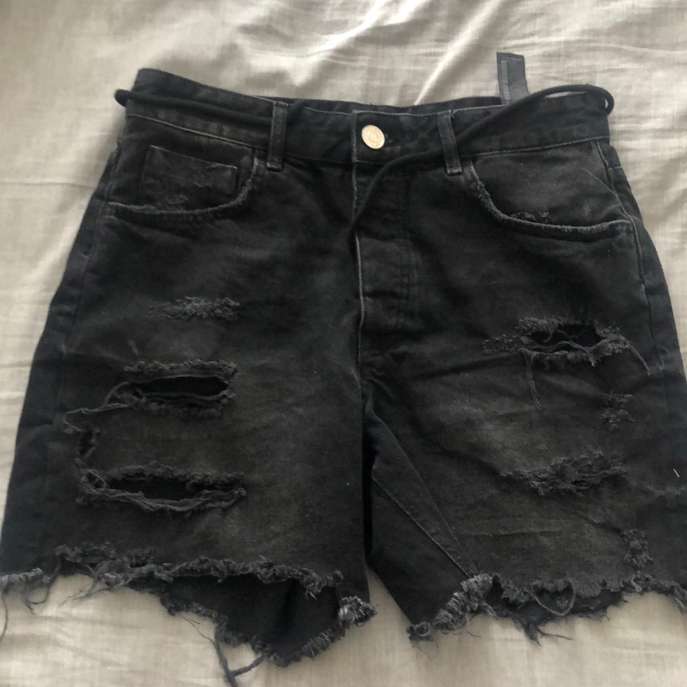 Edgy black frayed, distressed jean shorts